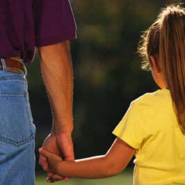 Father Holding Daughter's Hand